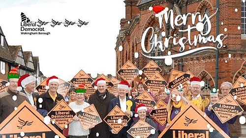 Lib Dems outside Wokingham town hall, with Santa hats, snow ans other Christmas items superimposed on top. The Lib Dem Wokingham logo has been made to look like Santa in his sleigh being pulled by Lib Dem birds