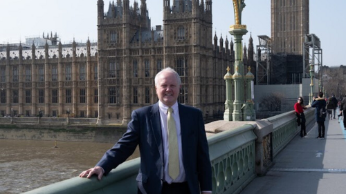 Clive standing on Westminister Bridge with Parliament behind him