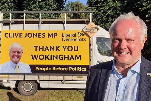 Clive with a van with a sign on the side saying "Clive Jones MP, Thank you Wokingham, People before Politics"