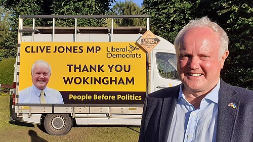 Clive with a van with a sign on the side saying "Clive Jones MP, Thank you Wokingham, People before Politics"