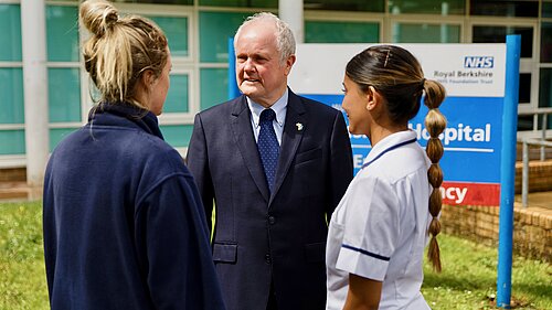 Clive Jones MP speaking to two nurses outside Royal Berkshire Hospital