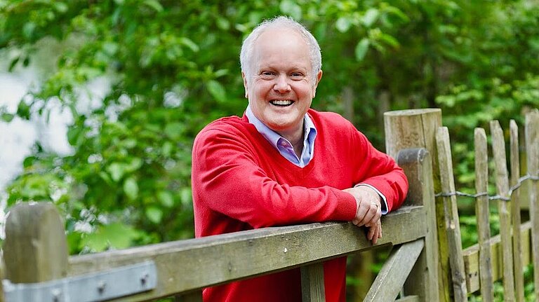 Clive standing in a field