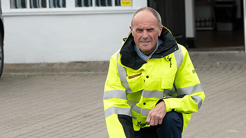 Paul in high-vis, examining the road