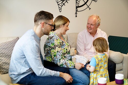 Clive Jones in a house with a young family