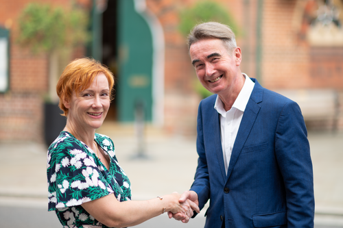 Stephen Conway shaking hands with Lou Timlin outside Wokingham Town hall